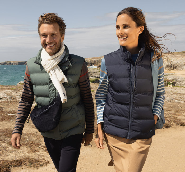Man and woman wearing sleeveless down jackets