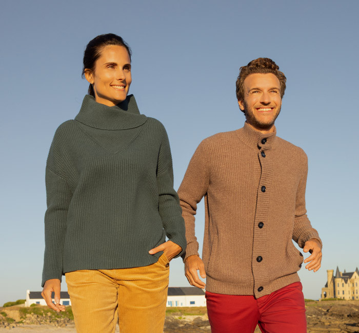 Woman wearing a wool sweater and man wearing a long wool cardigan